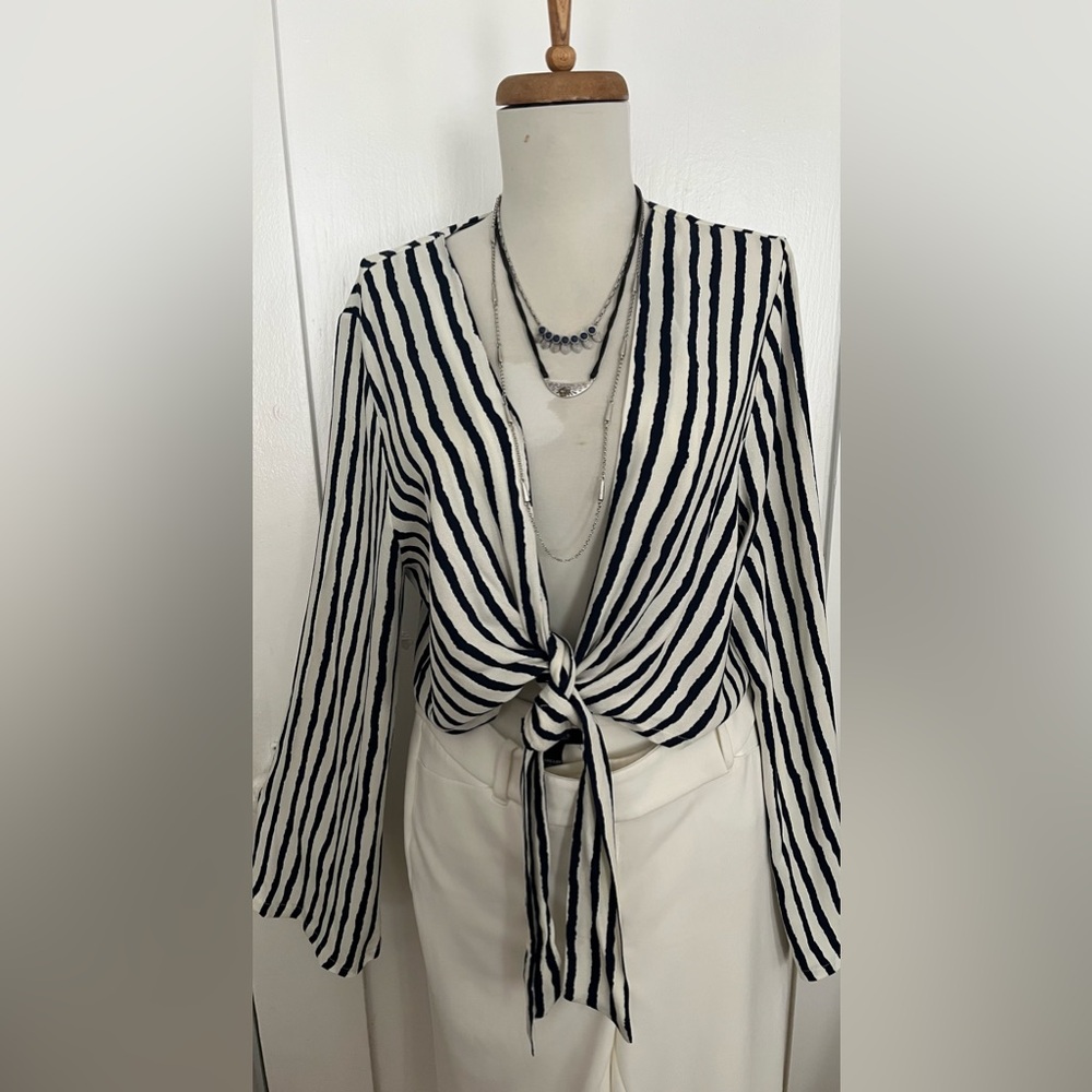 Stripe Blouse size L $20. Add White House Black Market White pants 6R $38.
